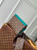 LOUIS VUITTON GASTON WEARABLE WALLET 18 IN BROWN MONOGRAM CANVAS MIX GREEN CALFSKIN
