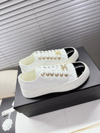 CHANEL 25S TRAINERS WHITE AND BLACK 35MM IN CALFSKIN