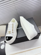 CHANEL 25S TRAINERS WHITE AND BLACK 35MM IN CALFSKIN