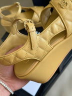 CHANEL CLASSIC WEDGE SANDALS IN LIGHT YELLOW LAMBSKIN