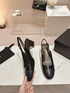 CHANEL SLINGBACKS IN BLACK SHEEPSKIN