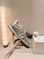 CHANEL SNEAKERS IN GLOSSY GOLDEN LAMBSKIN