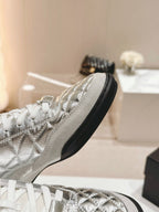 CHANEL SNEAKERS IN GLOSSY SILVER LAMBSKIN