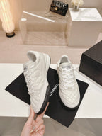 CHANEL SNEAKERS IN GLOSSY WHITE LAMBSKIN