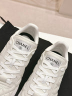 CHANEL SNEAKERS IN GLOSSY WHITE LAMBSKIN