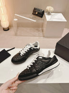 CHANEL SNEAKERS IN GLOSSY BLACK LAMBSKIN