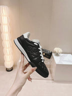 CHANEL SNEAKERS IN GLOSSY BLACK LAMBSKIN