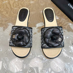 CHANEL PLATFORM SLIPPERS WITH FLOWER IN BLACK LAMBSKIN