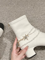 CHANEL LOW CUT BOOTS IN WHITE STRETCH LAMBSKIN AND GROSGRAIN WITH PEARL CHAIN
