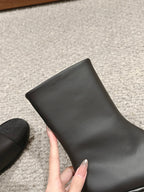 CHANEL SHORT BOOTS IN BLACK LAMBSKIN AND FABRIC