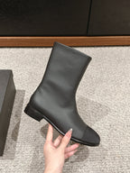 CHANEL SHORT BOOTS IN BLACK LAMBSKIN AND FABRIC