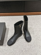 CHANEL SHORT BOOTS IN BLACK LAMBSKIN AND FABRIC