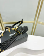 CHANEL SANDALS PEARL CHAIN IN BLACK COWHIDE