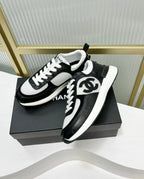CHANEL SNEAKER IN BLACK CALFSKIN AND GREY BREATHABLE MESH