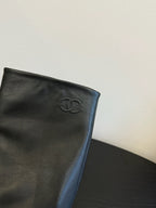 CHANEL BOOTS IN BLACK CALFSKIN WITH CHAIN