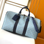LOUIS VUITTON LV 25S KEEPALL BANDOULIÈRE BAG 50 IN BLUE MONOGRAM HERITAGE CALFSKIN