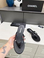 CHANEL THONG SLIPPERS IN BLACK COWHIDE