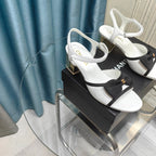 CHANEL SANDALS IN WHITE SHEEPSKIN WITH BLACK SATIN BOW
