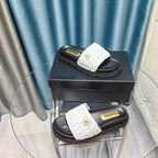 CHANEL KNIT SLIPPERS IN LIGHT PINK WOVEN SATIN AND BLACK SHEEPSKIN