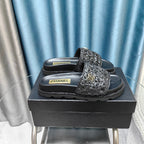 CHANEL KNIT SLIPPERS IN BLACK WOVEN SATIN AND SHEEPSKIN