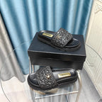 CHANEL KNIT SLIPPERS IN BLACK WOVEN SATIN AND SHEEPSKIN