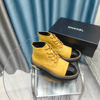 CHANEL SHORT BOOTS IN GOLD YELLOW SUEDE AND BLACK SHEEPSKIN