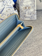 DIOR VERTICAL LONG ZIP WALLET 20 IN BABY BLUE QUILTED ALLOVER CALFSKIN