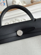 HERMES ZIP CABINE 31 BAG IN PALE GRAY CANVAS AND BLACK CALFSKIN