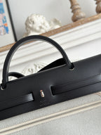 HERMES ZIP CABINE 31 BAG IN PALE GRAY CANVAS AND BLACK CALFSKIN