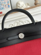 HERMES ZIP CABINE 31 BAG IN RUBY RED CANVAS AND BLACK CALFSKIN