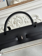 HERMES ZIP CABINE 31 BAG IN WHITE CANVAS AND BLACK CALFSKIN