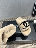 CHANEL 25S SLIPPERS THICK SOLED WITH EMBROIDERED LOGO IN BEIGE FUR