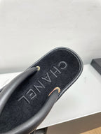 CHANEL THONG SLIPPERS IN BLACK LAMBSKIN
