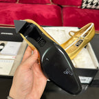CHANEL HIGH MARY JANE IN GOLDEN CALFSKIN AND BLACK SATIN