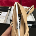 CHANEL HIGH MARY JANE IN DARK CREAM CALFSKIN AND BLACK SATIN