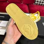 CHANEL TRAINERS IN BRIGHT YELLOW SHINY CALFSKIN
