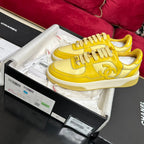 CHANEL TRAINERS IN BRIGHT YELLOW SHINY CALFSKIN