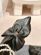 CHANEL SHORT BOOTS IN BLACK SHEEPSKIN WITH BOW