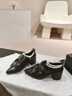 CHANEL SHORT BOOTS IN BLACK SHEEPSKIN WITH BOW