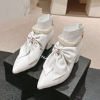 CHANEL SHORT BOOTS IN WHITE SHEEPSKIN WITH BOW