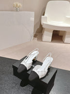 CHANEL HIGH SLINGBACKS IN WHITE LAMBSKIN AND BLACK SATIN