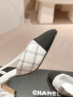 CHANEL HIGH SLINGBACKS IN WHITE LAMBSKIN AND BLACK SATIN
