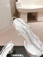 CHANEL HIGH SLINGBACKS IN WHITE LAMBSKIN AND BLACK SATIN