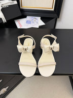 CHANEL FLAT SANDALS IN WHITE CALFSKIN WITH BOW