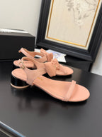 CHANEL FLAT SANDALS IN PEACHY PINK CALFSKIN WITH BOW