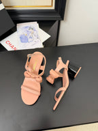 CHANEL MID HEEL SANDALS IN PEACHY PINK CALFSKIN WITH BOW