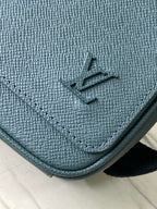 LOUIS VUITTON DISTRICT PM 26 IN CELESTE GREEN CALFSKIN