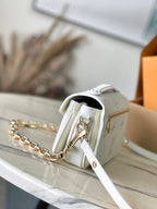 LOUIS VUITTON POCHETTE METIS EAST WEST 21 IN WHITE PURPLE MONOGRAM EMPREINTE LEATHER