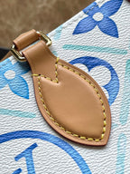 LOUIS VUITTON ONTHEGO EAST WEST 25 IN LAGOON BLUE MONOGRAM TILES CANVAS