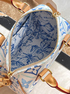 LOUIS VUITTON SPEEDY BANDOULIÈRE 20 IN LAGOON BLUE MONOGRAM TILES CANVAS GOLD BUCKLE